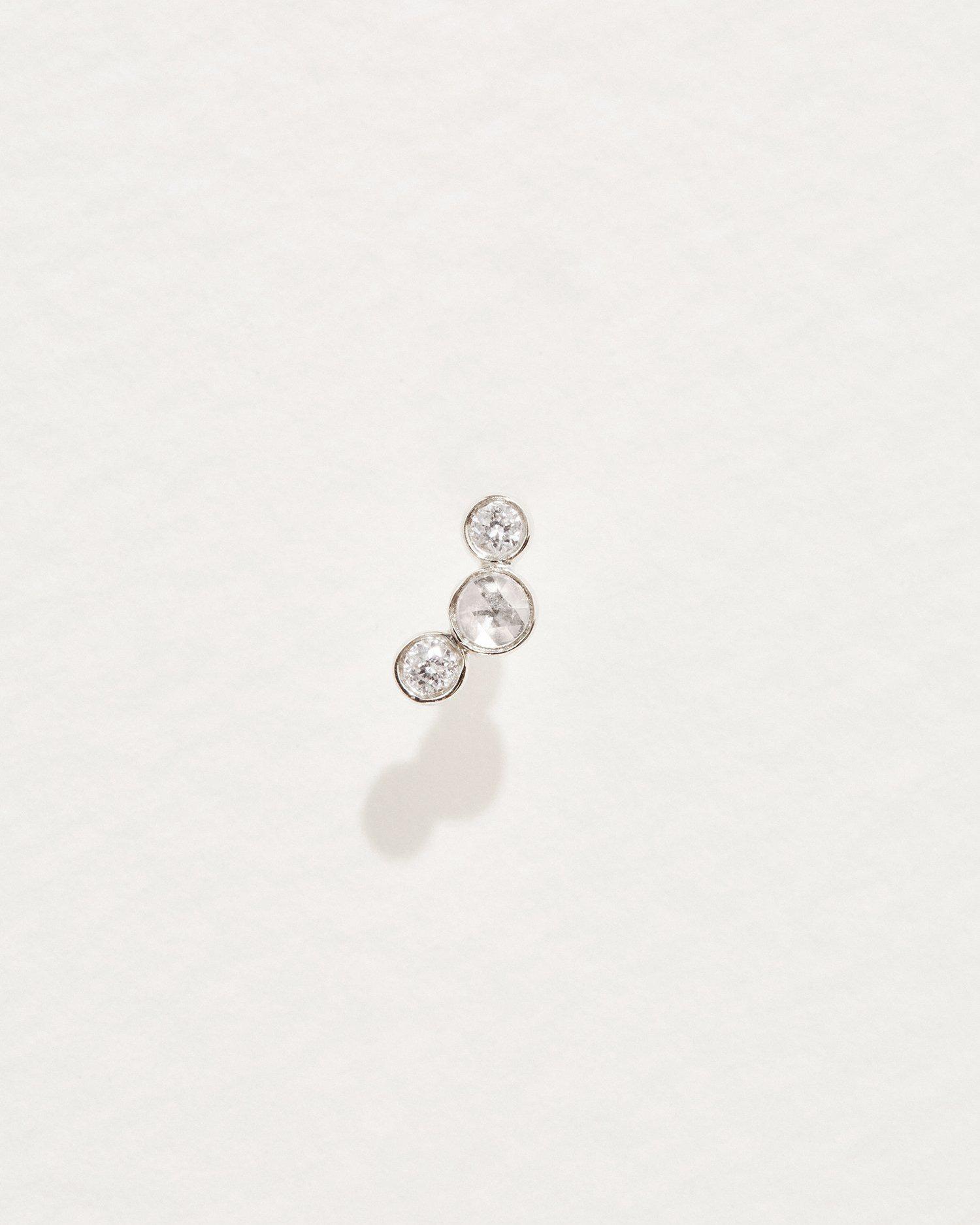 three diamonds stud piercing with white gold