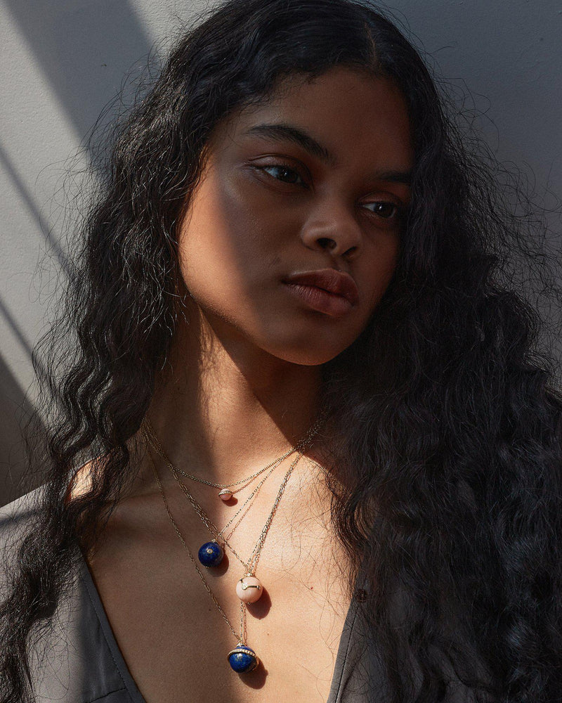 saturn necklace on the model